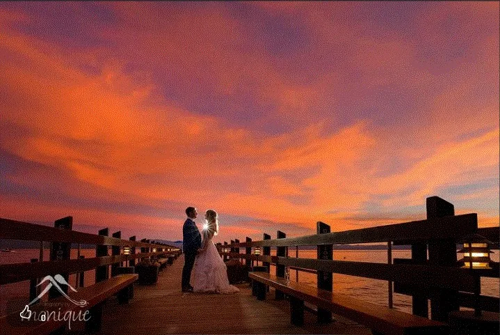 A couple on the pier at sunset