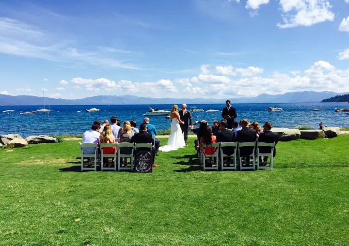 A ceremony on the lawn above the beach