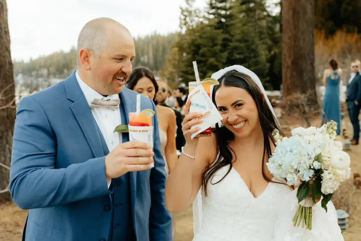 Newlyweds with a pair of Wet Woodys